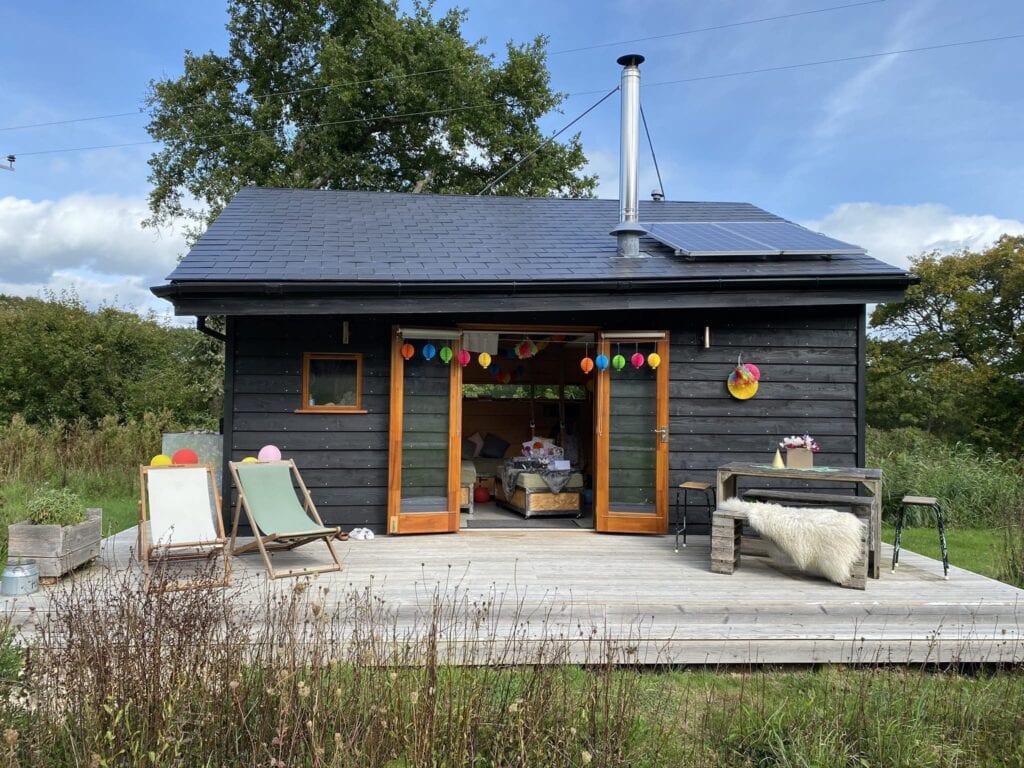Tiny Homes Holidays - Eco-friendly lodges for off-grid vacations on the Isle of Wight, set in a natural meadow, adjacent to ancient woodland