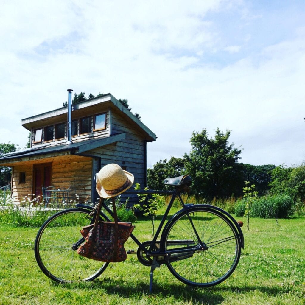 Tiny Homes Holidays - Eco-friendly lodges for off-grid vacations on the Isle of Wight, set in a natural meadow, adjacent to ancient woodland