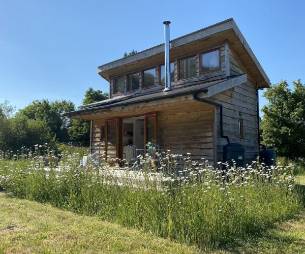 Tiny Homes Holidays - Eco-friendly lodges for off-grid vacations on the Isle of Wight, set in a natural meadow, adjacent to ancient woodland