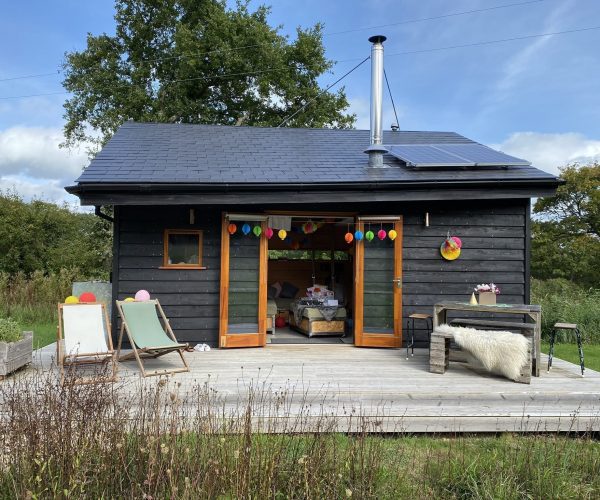 Tiny Homes Holidays - Eco-friendly lodges for off-grid vacations on the Isle of Wight, set in a natural meadow, adjacent to ancient woodland